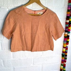 Anthropologie Everly Linen Orange Crop Blouse. It’s marked S but fits more XS.